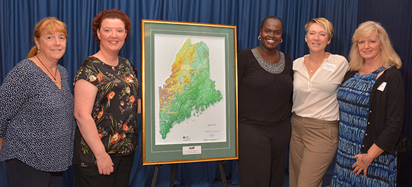 FAME's College Access and Financial Education team pose with their Champion of Education and Workforce Development Award presented by the Maine Development Foundation